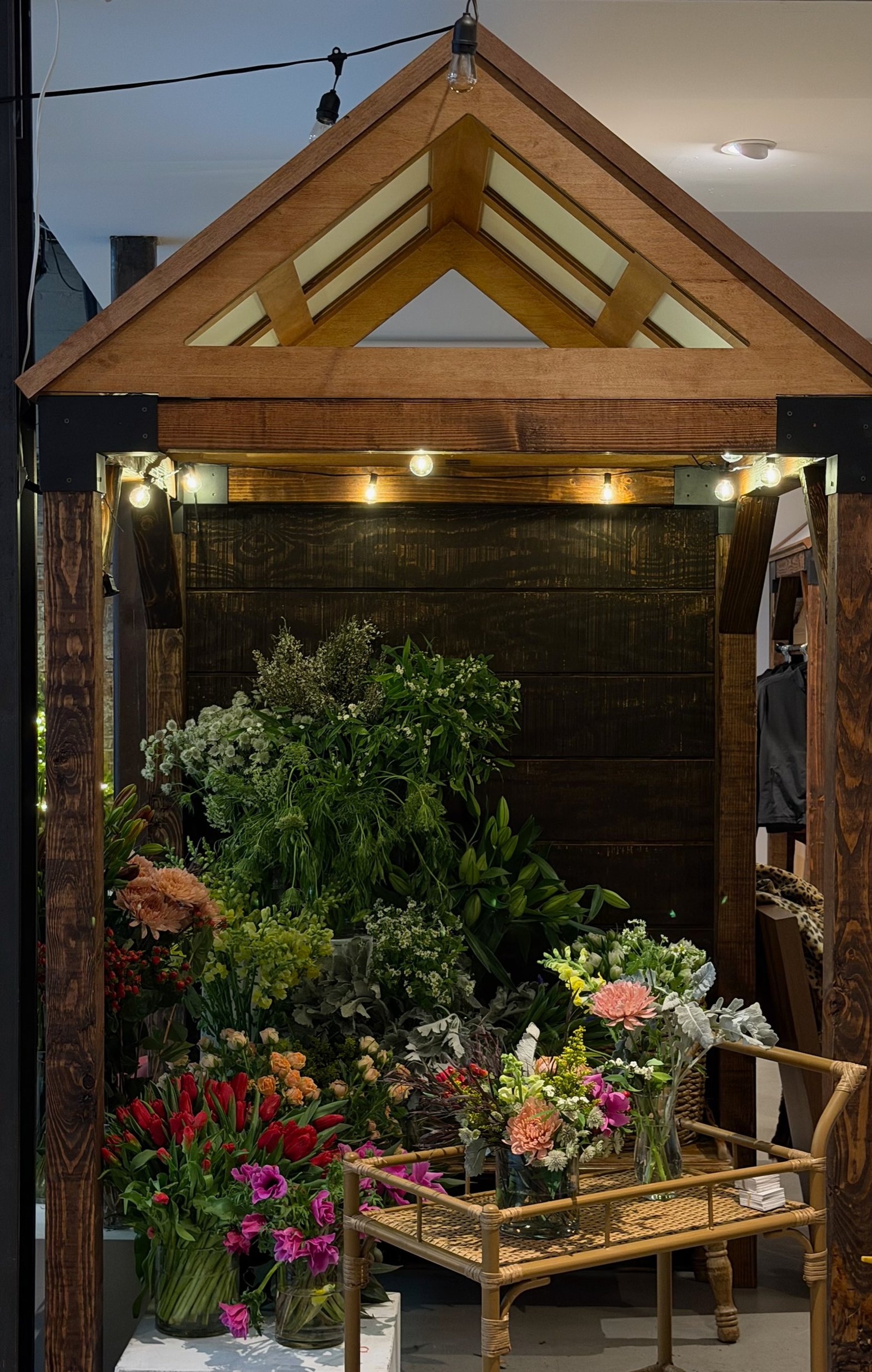 Floral Stand arrangement display with wooden arch and lighting